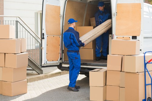 Furniture pick-up team removing bulky items from an Ilford property
