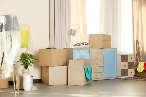 Office relocation planning in Ilford with moving boxes and workstations