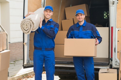Unpacking and organising rooms after a move in an Ilford property