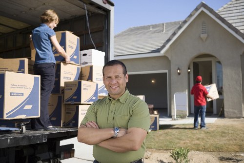 Local moving team handling boxes and furniture for an Ilford property move
