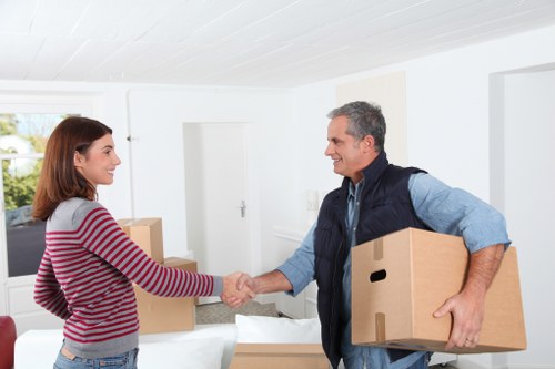 Packed boxes and furniture ready for a flat removal service in Ilford