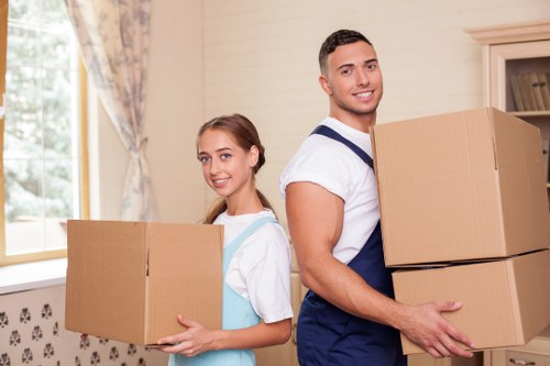 Packed boxes and furniture prepared for house removals in an Ilford home